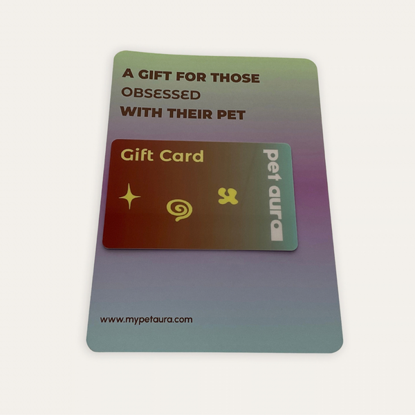 A pet-themed gift card set on a light background. The outer card is iridescent with a green-to-purple gradient and reads 'A GIFT FOR THOSE OBSESSED WITH THEIR PET'